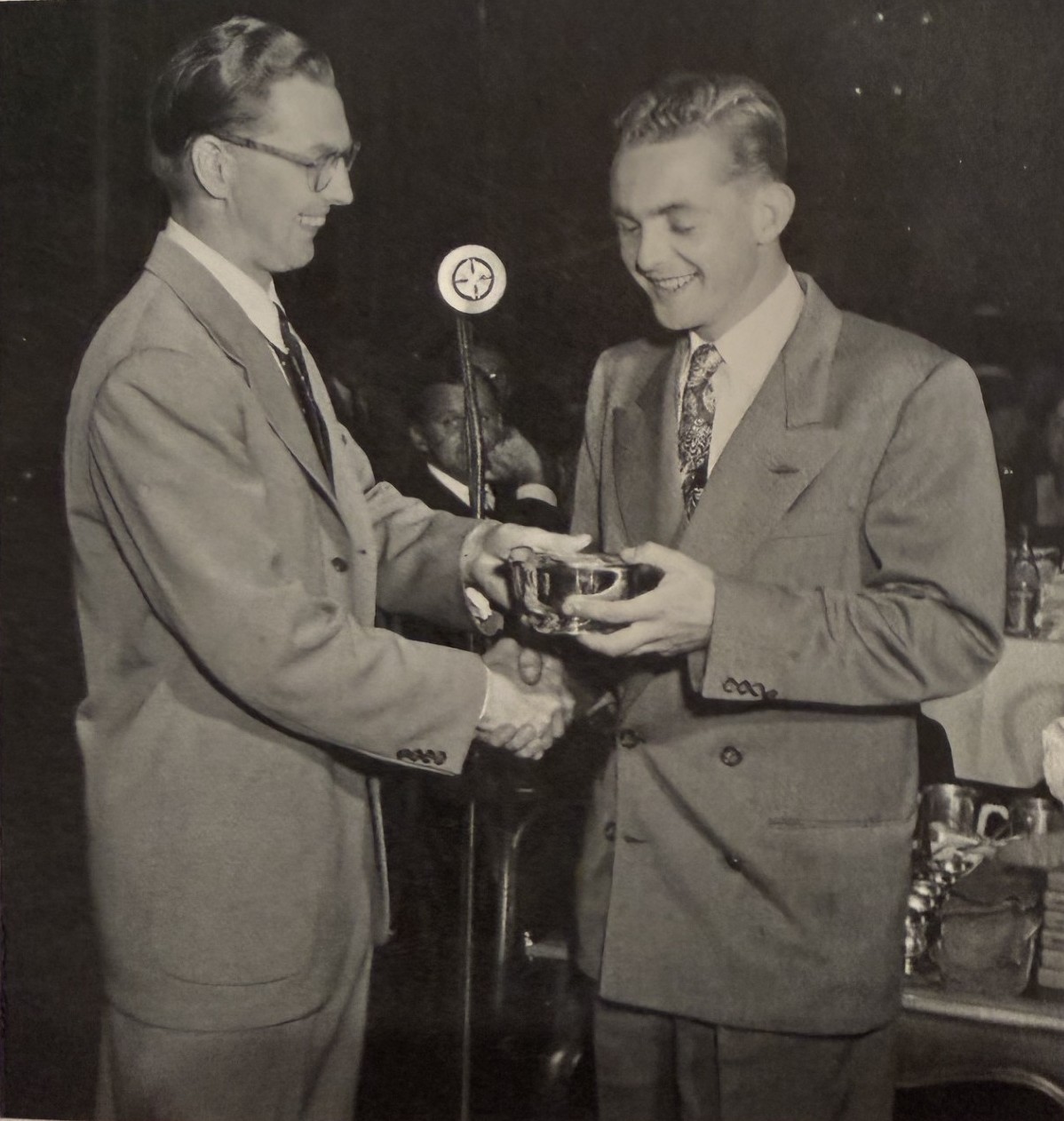 Kjell Qvale with Phil Hill at a trophy presentation